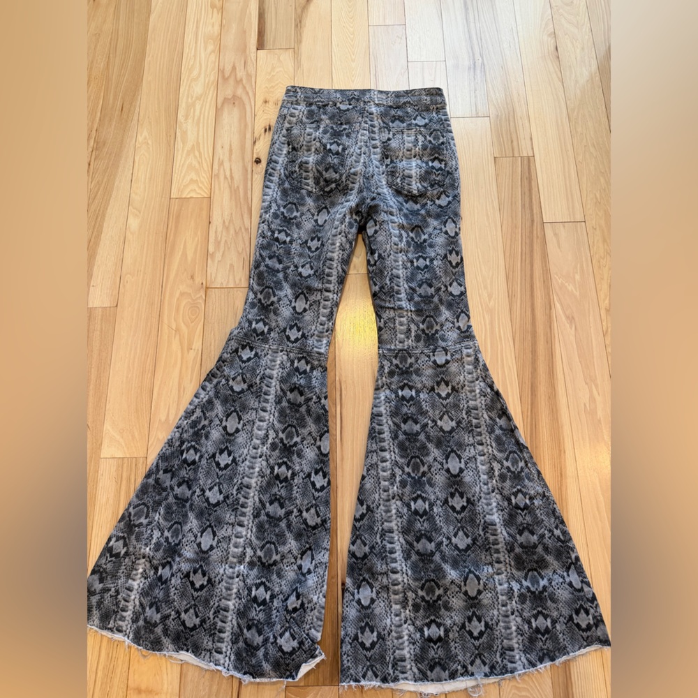 Free People We The Free Just Float On flare jeans in a gray snake print. - Picture 4 of 5